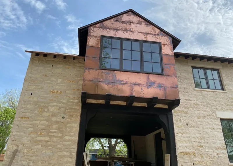 Copper metal panel facade on a stone building for Skylight Installation in San Buenaventura (Ventura)